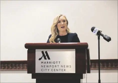  ?? MIKE CAUDILL/THE VIRGINIAN-PILOT VIA AP ?? Lawyer Diane Toscano, who represents Abigail Zwerner, the Newport News teacher who was shot by a sixyear-old student, reads a statement to media on Wednesday, in Newport News, Va.