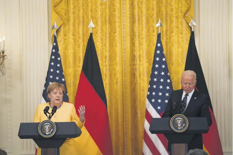  ??  ?? German Chancellor Angela Merkel (L) and U.S. President Joe Biden participat­e in a joint press conference in the East Room of the White House in Washington, D.C., U.S., July 15, 2021.