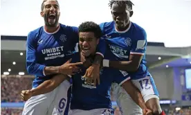  ?? Photograph: Steve Welsh/PA ?? Rangers' Malik Tillman (centre) celebrates with Connor Goldson (left) and Rabbi Matondo after his goal won the tie.