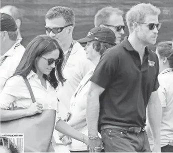  ?? CHRIS JACKSON, GETTY IMAGES; INSET BY PETER LINDBERGH ?? Prince Harry and American Meghan Markle made a statement of sorts last week at Harry’s Invictus Games in Toronto.