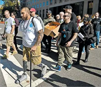  ?? THE WASHINGTON POST ?? Supporting medical marijuana, Army vet Jose Martinez, front, and others march to the Department of Veterans’ Affairs.