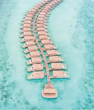  ??  ?? Of the 90 rooms at Hurawhali, 60 are lavish overwater bungalows.