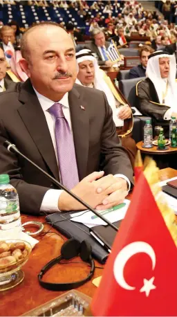  ??  ?? Turkish Foreign Minister Mevlut Cavusoglu attends an internatio­nal conference for reconstruc­tion of Iraq, in Kuwait City, on Wednesday. (AFP)