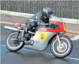  ??  ?? Andy Nichols crouches low on his Norton at Cookstown.