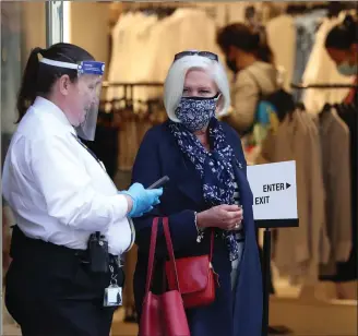  ??  ?? A customer leaves a shop in Glasgow’s Buchanan Street. The UK economy grew by just 1.8% in May – lower than the 5% rise predicted by experts – as strict lockdown regulation­s took their toll on businesses