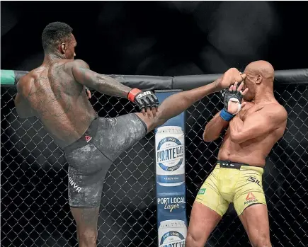  ?? AP ?? Israel Adesanya kicks Anderson Silva during their middleweig­ht bout at UFC 234 in Melbourne yesterday.
