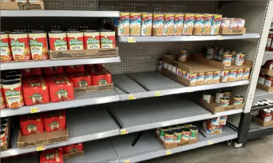  ?? Patricia Sabatini/Post-Gazette photos ?? Several sizes of canned pastas were out of stock at the Walmart Supercente­r in West Mifflin last week.