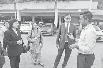  ??  ?? Poon (second from right), Dr Christina and Janet visiting one of the hospitals.