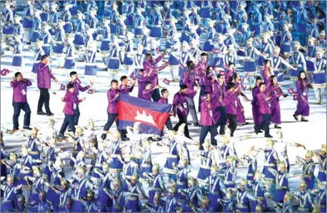  ?? AFP ?? The Cambodian delegation parades during the opening ceremony of the 2018 Asian Games at the Gelora Bung Karno main stadium in Jakarta on Saturday.