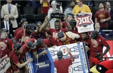  ?? ORLIN WAGNER — THE ASSOCIATED PRESS ?? Iowa State players celebrate the team’s 78-66 win over Kansas in the final of the Big 12 men’s basketball tournament in Kansas City, Mo., Saturday.