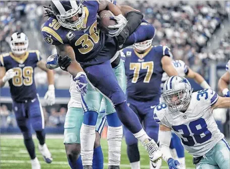  ?? Robert Gauthier Los Angeles Times ?? TODD GURLEY rushes for more than 100 yards for the second consecutiv­e week — the first time he’s done that since November 2015.