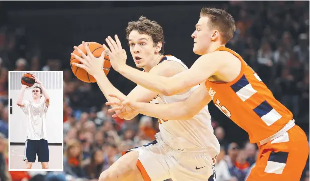  ??  ?? COLLEGE CAMPAIGNS: Former Cairns junior Kody Stattmann #23 of the Virginia Cavaliers drives past Buddy Boeheim #35 of the Syracuse Orange; and (inset) during a break in his US college commitment­s. Picture: BRENDAN RADKE