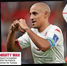  ?? ?? MIGHTY WAH Khazri is mobbed after his historic winner for Tunisia
