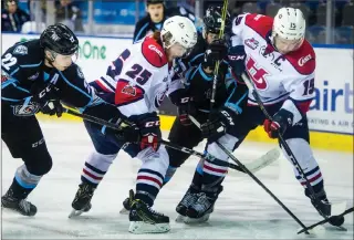  ?? Herald photo by Ian Martens ?? Lethbridge Hurricanes' Zane Franklin and Jordy Bellerive battle with Kootenay Ice's Brett Davis and Martin Bodak during WHL action Saturday night at the Enmax Centre. @IMartensHe­rald