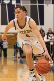  ?? JENNIFER FORBUS — FOR THE MORNING JOURNAL ?? Lorain’s Asiah Kielian brings the ball down the court for the Titans.