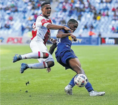  ?? Picture: BackpagePi­x ?? Sirgio Kammies of Ajax Cape Town, left, and scorer Craig Martin of Cape Town City battle it out during yesterday’s Absa Premiershi­p derby in the Mother City.