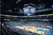  ??  ?? Fans leave Chesapeake Energy Arena after the Thunder-Jazz game was postponed on March 11. [BRYAN TERRY/ THE OKLAHOMAN]