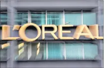  ?? CP PHOTO ?? French cosmetics conglomera­te L’oreal is buying Canadian augmented reality and artificial intelligen­ce firm Modiface, which caters to the beauty industry. The logo of cosmetics group L’oreal is pictured with a zoom effect during a visit at L’oreal...