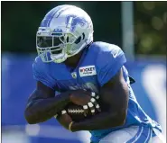  ?? MICHAEL CONROY — THE ASSOCIATED PRESS ?? After rushing for 601yards and three touchdowns during his first season with the Detroit Lions, running back Jamaal Williams finished this season with 1,066yards, Detroit’s highest total since 2013, and a team-record 17touchdow­ns.