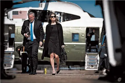  ?? DOUG MILLS/THE NEW YORK TIMES ?? Senior adviser Hope Hicks, who recently tested positive for COVID-19, walks with White House chief of staff Mark Meadows on Thursday in Maryland.