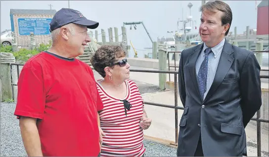  ?? ASHLEY THOMPSON ?? Kings-Hants MP Scott Brison speaks with Harbour Authority of Halls Harbour operations manager Charles Skerry and Skerry’s wife following a funding announceme­nt in the coastal community July 18.