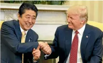  ?? REUTERS ?? Donald Trump compliment­ed Japanese Prime Minister Shinzo Abe’s ‘‘strong hands’’ during their meeting yesterday.