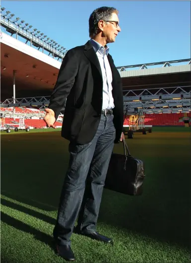  ??  ?? Liverpool owner John Henry takes in a tour of Anfield during his first day on the job after the Fenway Sports Group takeover