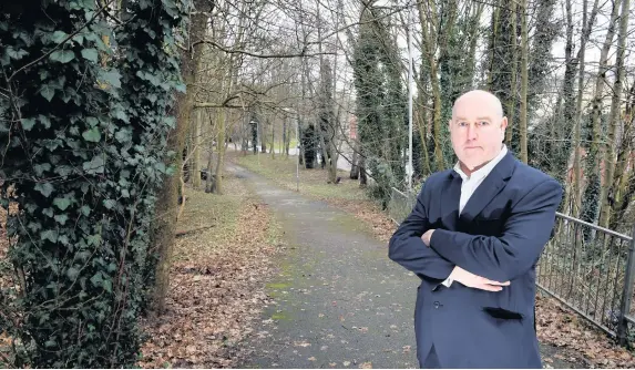  ??  ?? > Reporter Geraint Thomas was robbed at knifepoint by two attackers on this Swansea footpath while walking to work