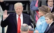  ?? The Associated Press
Matt Rourke / ?? Donald Trump is sworn in as the 45th president of the United States as Melania and Barron Trump look on Jan. 20 during the inaugurati­on ceremonies.