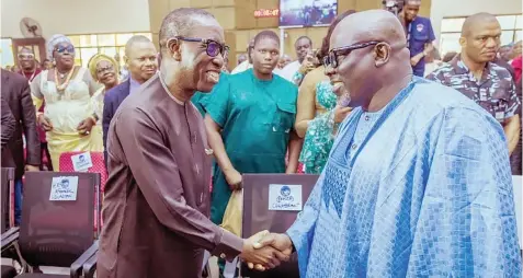  ?? ?? Delta Governor, Sheriff Oborevwori ( right), exchanging pleasantri­es with his predecesso­r, Senator Ifeanyi Okowa at the 60th birthday anniversar­y celebratio­n in honour of the Chairman, PDP, Delta State, Olorogun Kingsley Esiso at Sapele... yesterday