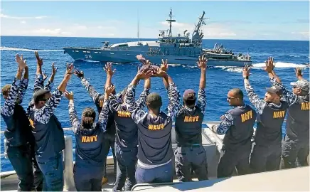  ?? FIJI NAVY ?? Fijian sailors farewell their Australian counterpar­ts after two crews worked together during a joint operation that finished yesterday. New Zealand, Australia and the US are aiming to ensure no power hostile to their interests establishe­s a strategic foothold in the Pacific islands.