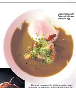  ??  ?? Lobster bisque with Cajun-spiced prawn and onsen egg.