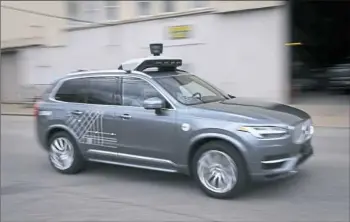  ?? Steve Mellon/Post-Gazette ?? Uber’s self-driving cars returned to the streets on July 24. Uber says, for now, human hands will be at the wheels of the autonomous vehicles at all times.