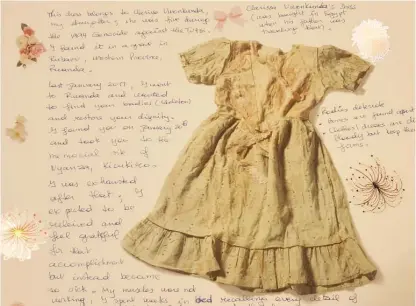  ?? MIRIAM DI NUNZIO/SUN-TIMES PHOTOS ?? This blood-stained dress from a 5-year-old girl killed in the Rwandan genocide is one of the many mementos included in a new exhibit at the Illinois Holocaust Museum and Education Center in Skokie.