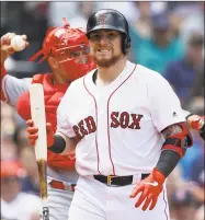  ?? Steven Senne / Associated Press ?? Christian Vazquez of the Red Sox returns to the dugout after striking out in the second inning on Sunday against the Angels in Boston.