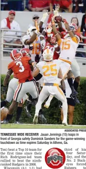  ?? ASSOCIATED PRESS ?? TENNESSEE WIDE RECEIVER Jauan Jennings (15) leaps in front of Georgia safety Dominick Sanders for the game-winning touchdown as time expires Saturday in Athens, Ga. NORTH CAROLINA 37, NO. 12 FLORIDA STATE 35