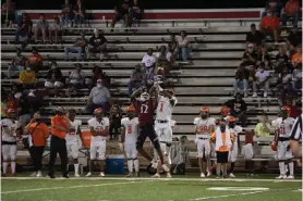  ?? Staff photo by Kelsi Brinkmeyer ?? ■ Hope Bobcats wide receiver Chelerome McFadden collides with Nashville Scrappers wide receiver La’dainian Hendrix as both attempt to catch the ball Friday night at Hope, Ark.