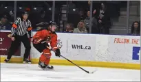  ?? NEWS PHOTO JAMES TUBB ?? Medicine Hat Tigers captain Tyler MacKenzie carries the puck up ice in the first period of a 4-3 OT loss Saturday at Co-op Place to the Swift Current Broncos.