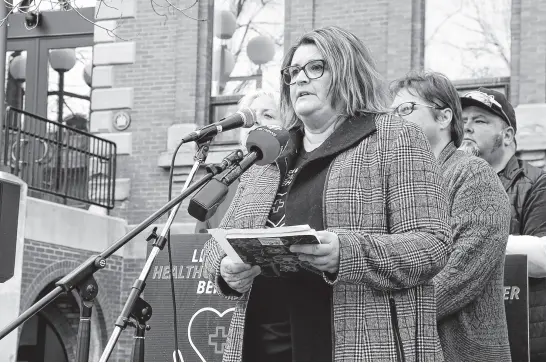  ?? STU NEATBY • THE GUARDIAN ?? Lori Mackay, a representa­tive of the CUPE P.E.I. health care council, speaks during a rally outside the Coles Building on April 11. Mackay said proposed wage increases for health support staff at Health P.E.I. are far below what workers have lost due to inflation in the last few years.