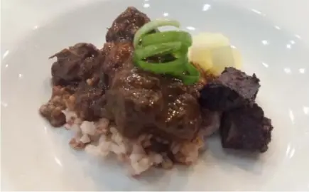  ??  ?? Braised beef shanks with pinuneg, finished in savory chocolate sauce.