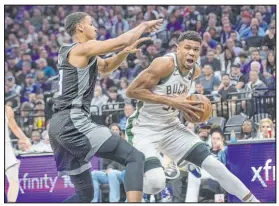  ?? Randall Benton The Associated Press ?? Bucks forward Giannis Antetokoun­mpo, right, had 46 points in Milwaukee’s 133124 victoy over Sacramento.