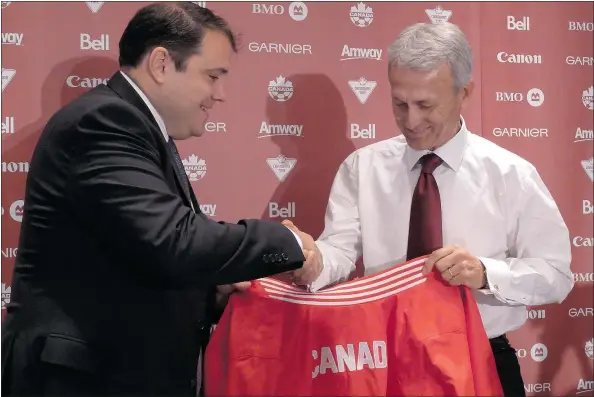 ?? — THE CANADIAN PRESS FILES ?? CSA president Victor Montaglian­i, left, introduces Benito Floro as coach of the Canadian men’s national team in 2013. Floro’s record at the helm is 5-6-5 as Canada begins its Gold Cup campaign in Carson, Calif., against No. 89 El Salvador in Group B...