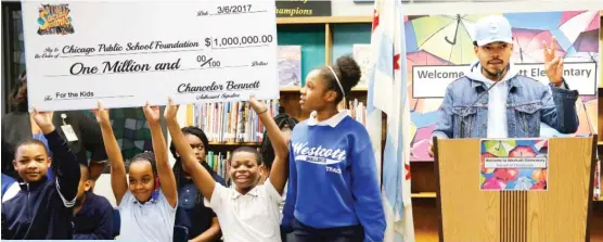  ?? | CHARLES REX ARBOGAST/ AP ?? Chance The Rapper announces a gift of $ 1 million to CPS atWestcott Elementary School last week.