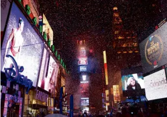  ?? AP ?? NEWYORK Confetti falls during the annual New Year’s Eve celebratio­n in Times Square on Friday in New York City.