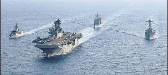  ?? REUTERS ?? A file photo of Australian and American navy ships in the disputed waters of the South China Sea.