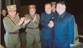  ?? EPA PIC ?? North Korean leader Kim Jongun (right) supervisin­g the testfire of an ICBM at an undisclose­d location in North Korea on Friday.