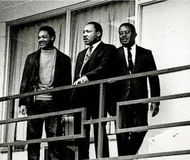  ?? AP FILE ?? The Rev. Martin Luther King Jr. is flanked by fellow civil rights leaders the Rev. Jesse Jackson (left) and the Rev. Ralph Abernathy at the Lorraine Motel in Memphis, Tenn., in 1968. A day later, King was fatally shot at the motel.