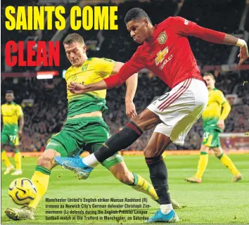  ??  ?? Manchester United's English striker Marcus Rashford (R) crosses as Norwich City's German defender Christoph Zimmermann (L) defends during the English Premier League football match at Old Trafford in Manchester, on Saturday