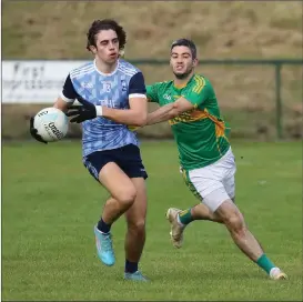  ?? ?? Cillian Murry shields the ball as he attempts to get past Ronan Ormsby.