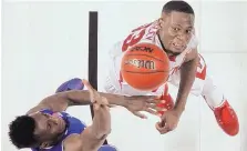  ?? RAINIER EHRHARDT/ASSOCIATED PRESS ?? Seton Hall’s Myles Powell, left, shoots over Arkansas’ Moses Kingley during their game Friday.